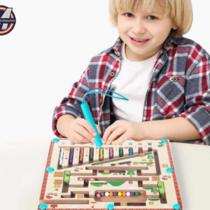 Young boy playing with a wooden magnetic maze puzzle board and colorful beads using a magnetic pen – top kids toy in UAE by Mini Marvels Emporium