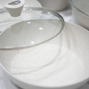 Large 24cm deep grey marble non-stick casserole pot with tempered glass lid and black cool-touch handles.